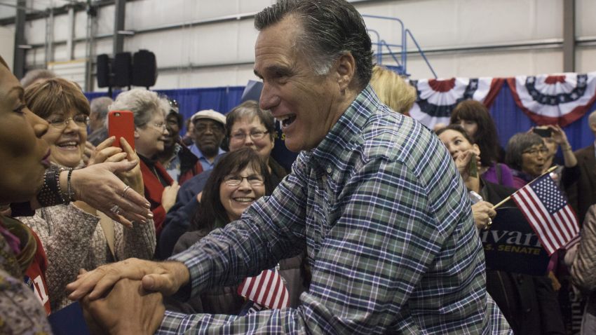 ANCHORAGE, AK - NOVEMBER 03: Former Massachusetts Gov. Mitt Romney greets the crowd during a rally for Republican Senate candidate Dan Sullivan at a PenAir airplane hangar on November 3, 2014 in Anchorage, Alaska. The U.S. Senate race in Alaska between incumbent Democratic Sen. Mark Begich and Republican candidate Dan Sullivan continues to be closely contested. (Photo by David Ryder/Getty Images)
