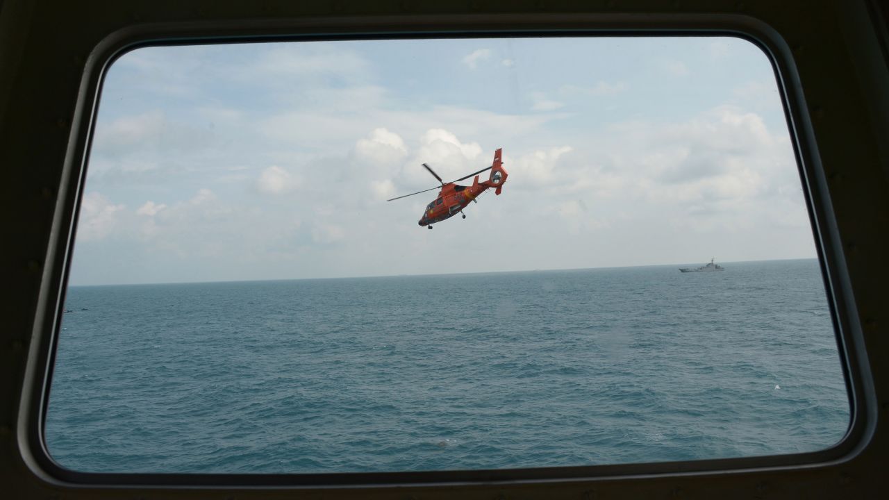 An Indonesian rescue helicopter flies during search operations in the Java Sea on Friday, January 9.