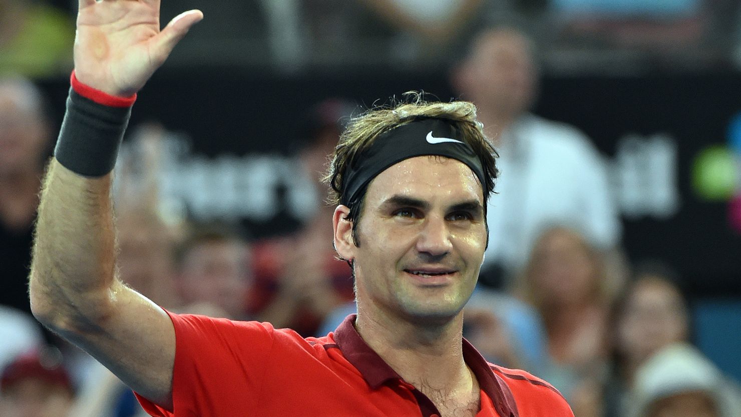 Roger Federer takes the applause after defeating Grigor Dimitrov at the Brisbane International.