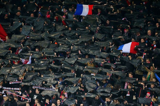 In the stands, Reims' supporters held black flags and the French tricolor aloft to mark their own tribute to the victims of this week's terror attacks.