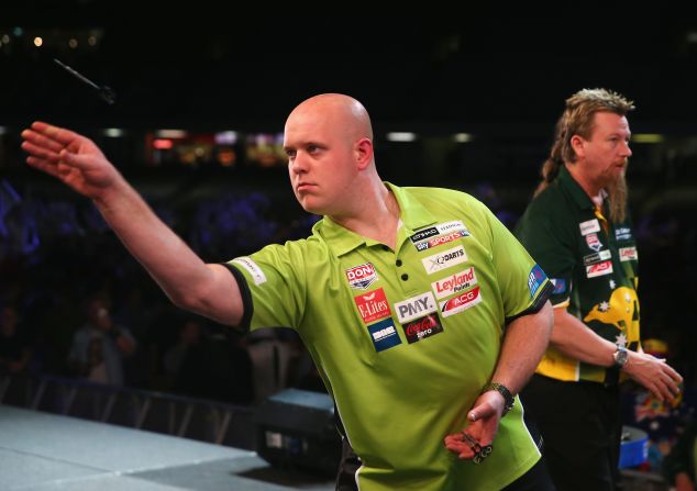 2014 world champion Michael van Gerwen of the Netherlands throws a dart on his way to beating Australia's Simon Whitlock in the final of the international event in Melbourne, which descended into chaos due to fan behavior.