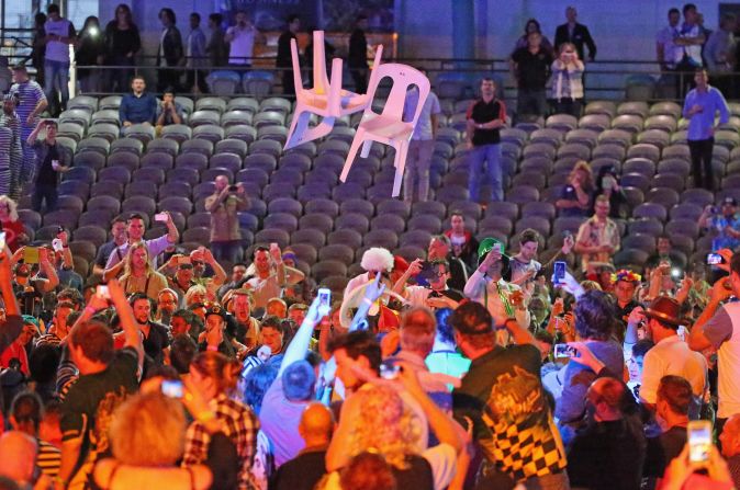 Plastic chairs were thrown in the air by the unruly crowd at the Etihad Stadium in Melbourne which appeared to encourage others to do the same.