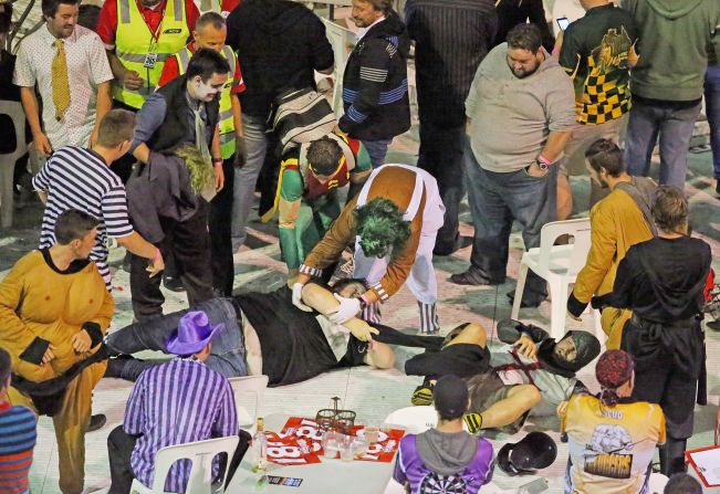 Fans in fancy dress ended up sprawled on the ground in the ensuing chaos as the crowd grew more unruly.