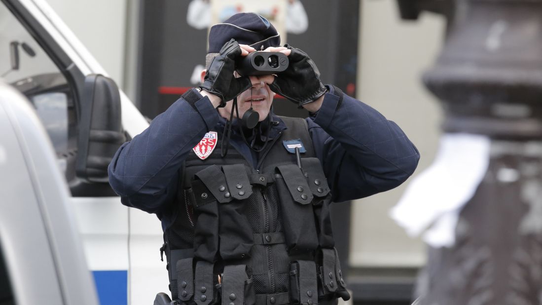 A police officer keeps watch before the rally.