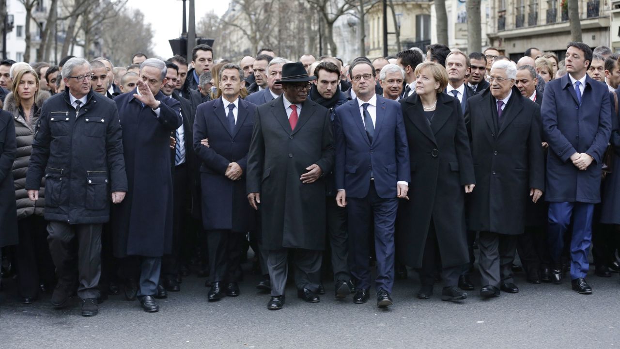 European Commission President Jean-Claude Juncker, from left, Israel's Prime Minister Benjamin Netanyahu, former French President Nicolas Sarkozy, Mali's President Ibrahim Boubacar Keita, French President Francois Hollande, Germany's Chancellor Angela Merkel, Palestinian Authority President Mahmoud Abbas and Italy's Prime Minister Matteo Renzi walk together as they lead thousands of people during the rally.