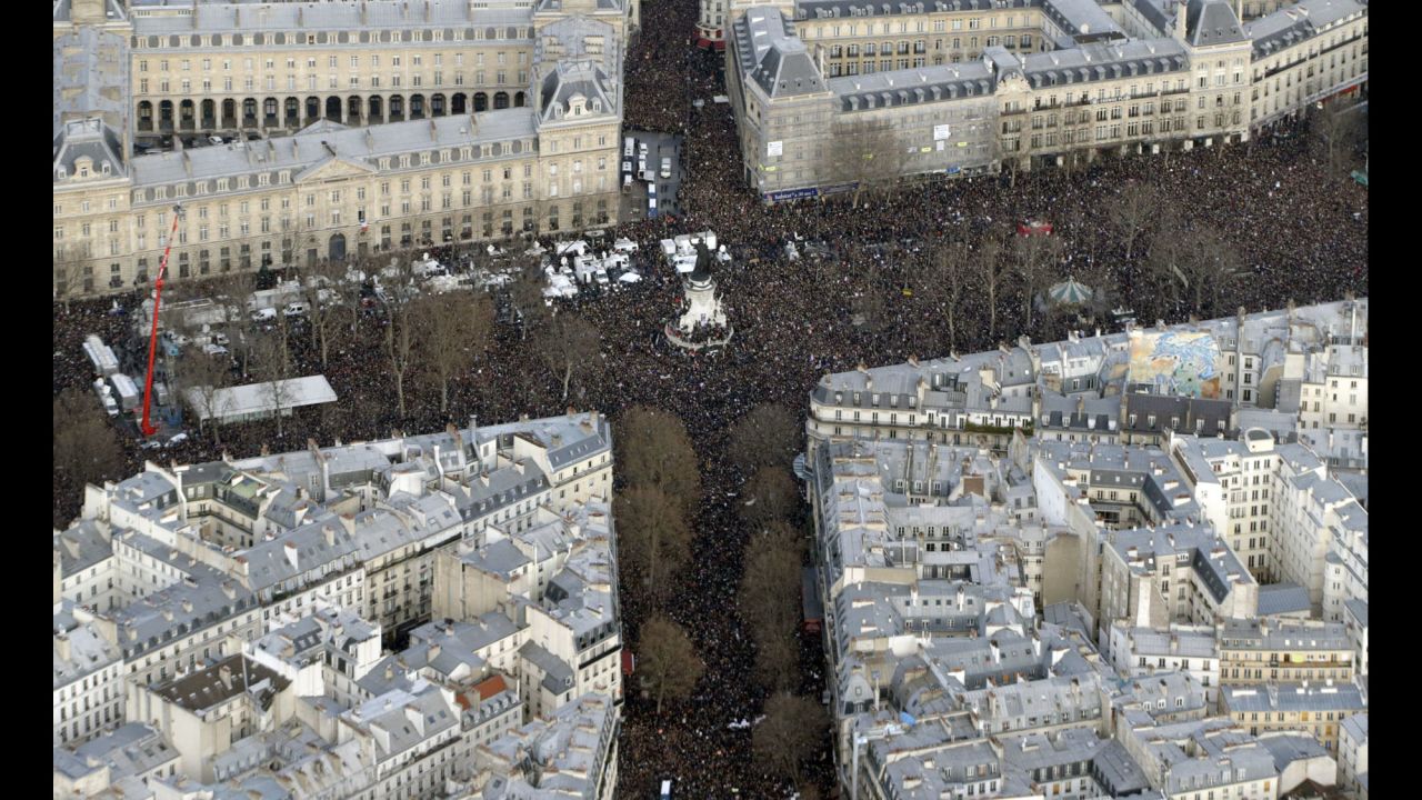 The massive crowd at the Place de la Republique is seen from above.