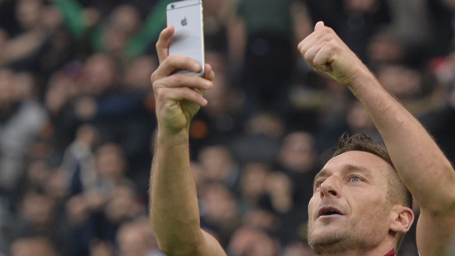 Francesco Totti takes a 'selfie' after scoring his second and the equalizer against Lazio in the Olympic Stadium.