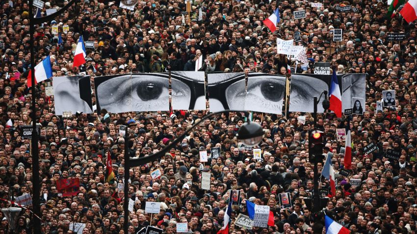 Caption:PARIS, FRANCE - JANUARY 11: Demonstrators make their way along Boulevrd Voltaire in a unity rally in Paris following the recent terrorist attacks on January 11, 2015 in Paris, France. An estimated one million people are expected to converge in central Paris for the Unity March joining in solidarity with the 17 victims of this week's terrorist attacks in the country. French President Francois Hollande will lead the march and will be joined by world leaders in a sign of unity. The terrorist atrocities started on Wednesday with the attack on the French satirical magazine Charlie Hebdo, killing 12, and ended on Friday with sieges at a printing company in Dammartin en Goele and a Kosher supermarket in Paris with four hostages and three suspects being killed. A fourth suspect, Hayat Boumeddiene, 26, escaped and is wanted in connection with the murder of a policewoman. (Photo by Christopher Furlong/Getty Images)