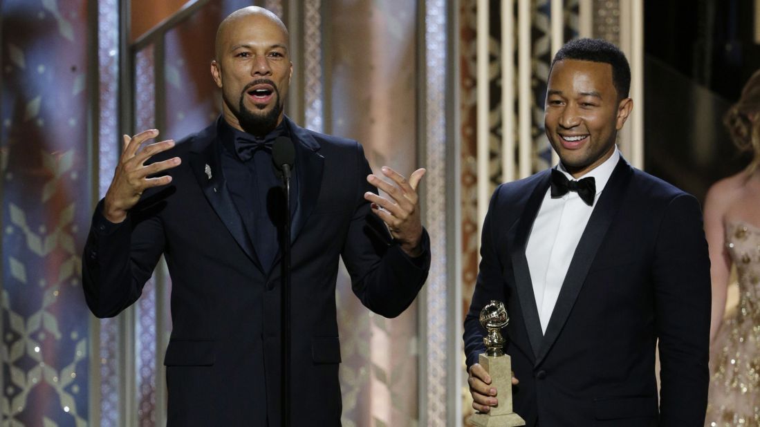 Common, left, and John Legend accept the award for their song "Glory" from the movie "Selma."