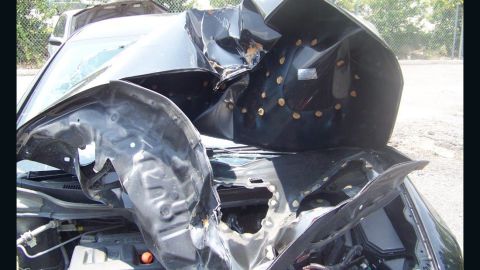 The Louisiana Attorney General says this car had what it calls an "aftermarket" hood part, and when the car was in a wreck, the hood crumpled in a way it should not have.