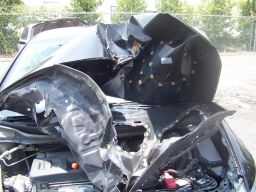 The Louisiana Attorney General says this car had what it calls an "aftermarket" hood part, and when the car was in a wreck, the hood crumpled in a way it should not have.