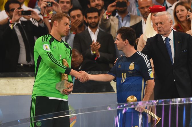Messi, who was awarded the Player of the Tournament trophy, shakes hands with Manuel Neuer (winner of the Golden Glove award) following the conclusion of the final at the Maracana Stadium in Rio de Janeiro, Brazil. After demolishing the hosts 7-1 in the semifinal, Germany edged past Argentina 1-0 in the final.