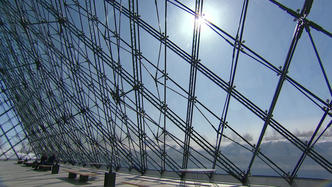 The Glass Pyramid in Moerenuma Park stores snow in winter for cooling in summer.