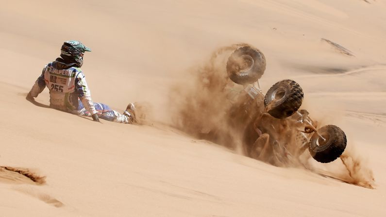 Sebastian Halpern watches his quad as it rolls down a sand dune Wednesday, January 7, during Day 4 of the Dakar Rally. The stage started in Chilecito, Argentina, and ended in Copiapo, Chile.