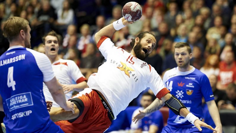 Danish handball player Jesper Noddesbo prepares to throw the ball against Iceland during a Totalkredit Cup match played Saturday, January 10, in Aalborg, Denmark.