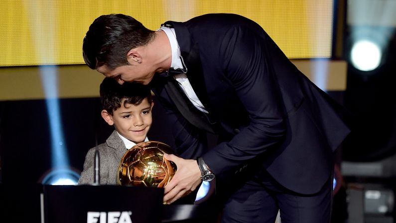 Soccer star Cristiano Ronaldo <a href="index.php?page=&url=http%3A%2F%2Fwww.cnn.com%2F2015%2F01%2F12%2Ffootball%2Ffifa-ballon-dor-winner-2014%2F" target="_blank">accepts the FIFA Ballon d'Or</a> with his son, Cristiano Jr., at a ceremony in Zurich, Switzerland, on Monday, January 12. The award is given annually to the world's best player as chosen by a panel of players, coaches and media members. This is Ronaldo's third Ballon d'Or and second in a row.