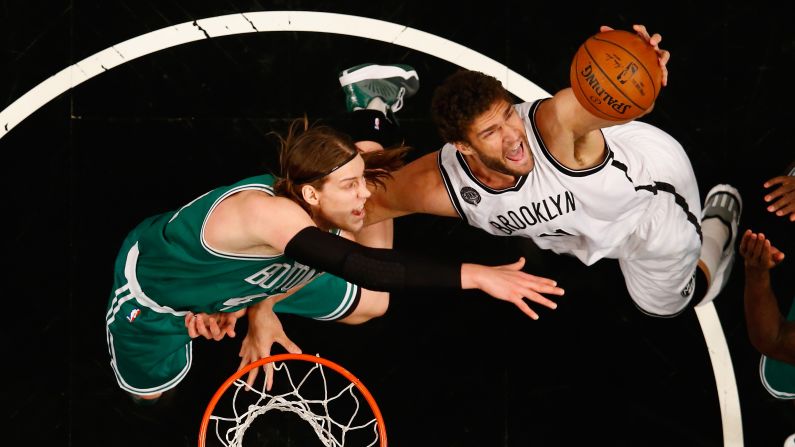Boston's Kelly Olynyk, left, and Brooklyn's Brook Lopez battle for a rebound during a game in New York on Wednesday, January 7.