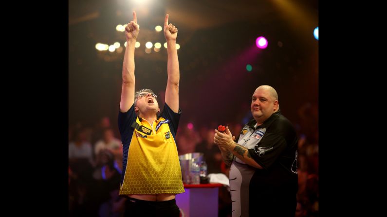 Jeff Smith celebrates after defeating Robbie Green in the quarterfinals of the BDO World Darts Championship on Friday, January 9. The tournament, which took place in Frimley, England, was won by Scott Mitchell.