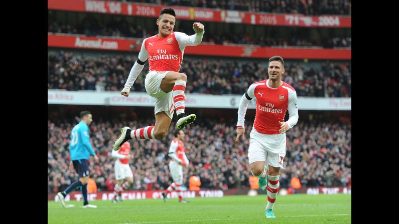Arsenal's Alexis Sanchez leaps in the air after scoring a goal against Stoke City during a home match in London on Sunday, January 11. Sanchez had two goals in the game as Arsenal won 3-0.