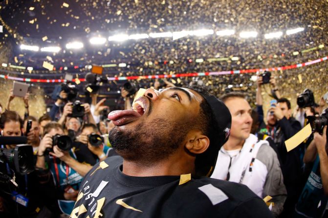 Ohio State running back Ezekiel Elliott tries to catch confetti in his mouth after his team won the national championship game Monday, January 12, in Arlington, Texas. Elliott had 246 yards rushing and four touchdowns as the Buckeyes defeated Oregon 42-20. It was Ohio State's first national title since 2002.