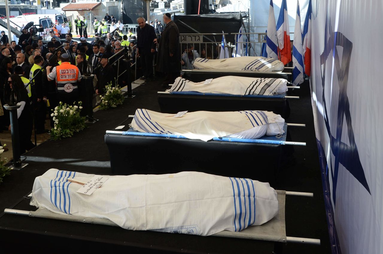 The bodies of Hattab, Yohan Cohen, Philippe Braham, and Francois-Michel Saada are laid out for their funeral in Jerusalem.