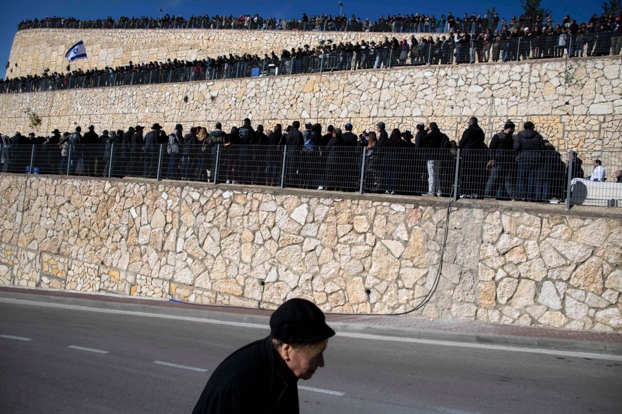 People attend the funeral service in Jerusalem on January 13.