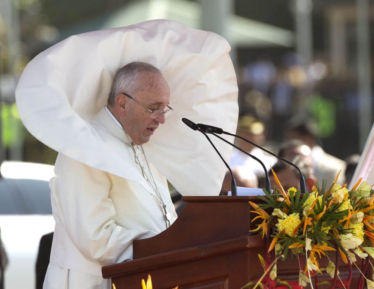 Wind blows Pope Francis' clothes as he delivers a speech at Bandaranaike International Airport near Colombo on January 13.