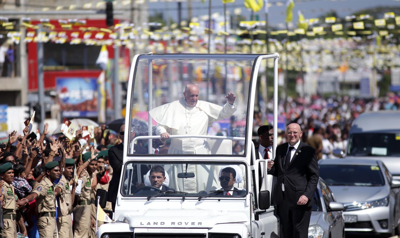 Pope Francis waves to people on the outskirts of Colombo on January 13.