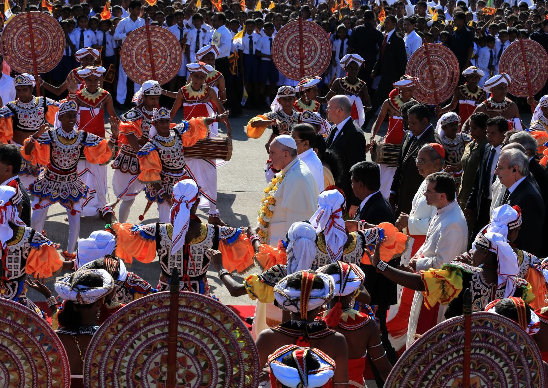 Pope Francis is welcomed in a ceremony at the airport.
