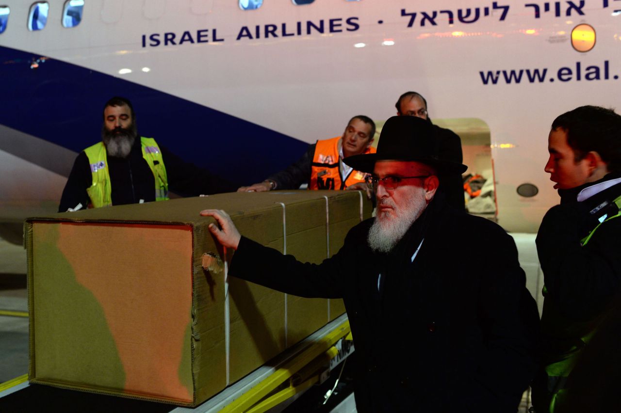 The coffins of the four victims arrive at Ben Gurion airport on the morning of January 13 in Tel Aviv.