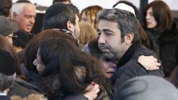 Israeli mourners hug at the funeral in Jerusalem of four French Jews killed in an attack on a kosher supermarket in Paris last week.