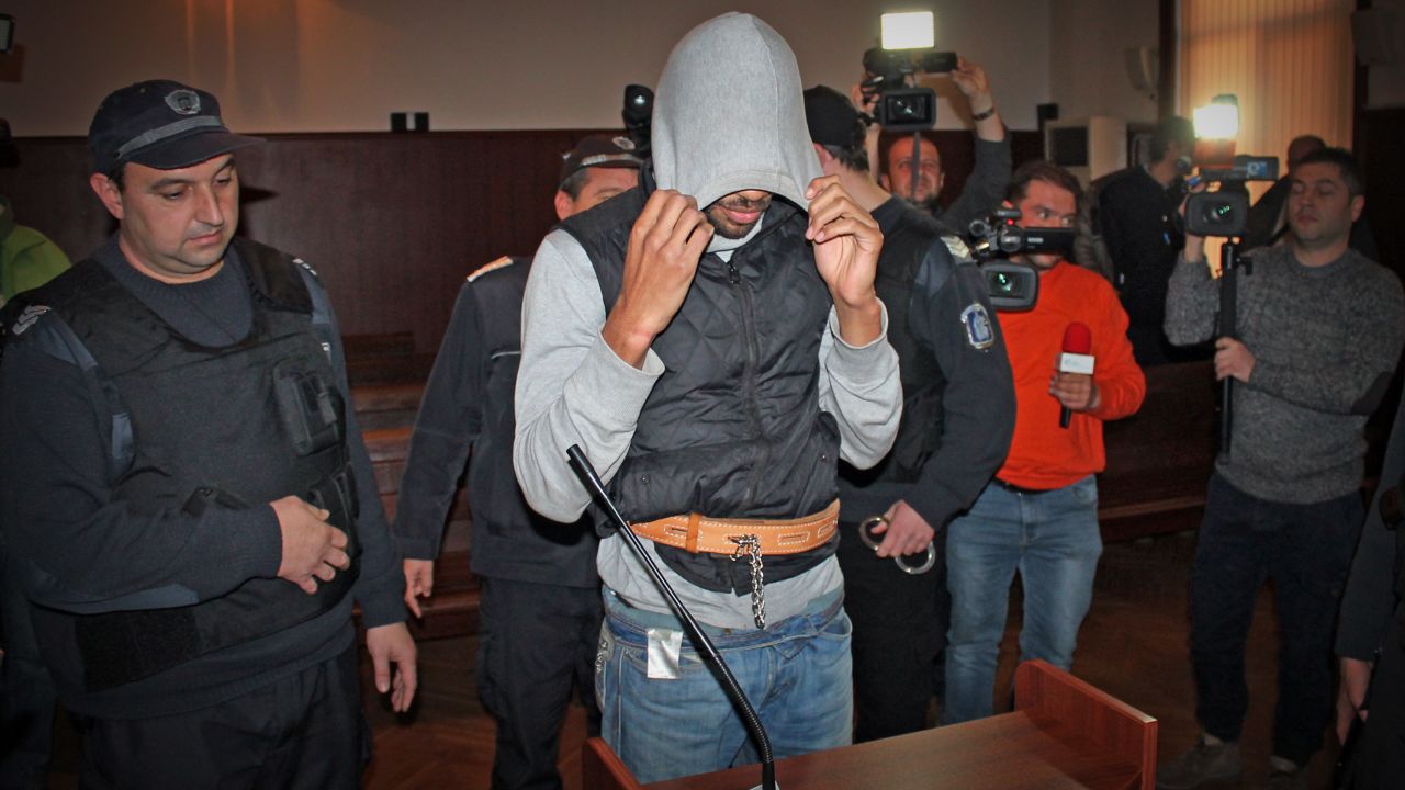 French citizen Fritz-Joly Joachin, 29, covers his face inside a Bulgarian courtroom this week.