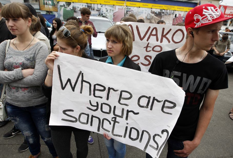 Anti-Putin protesters in Kiev demand action against Russia over alleged actions in Ukraine. 