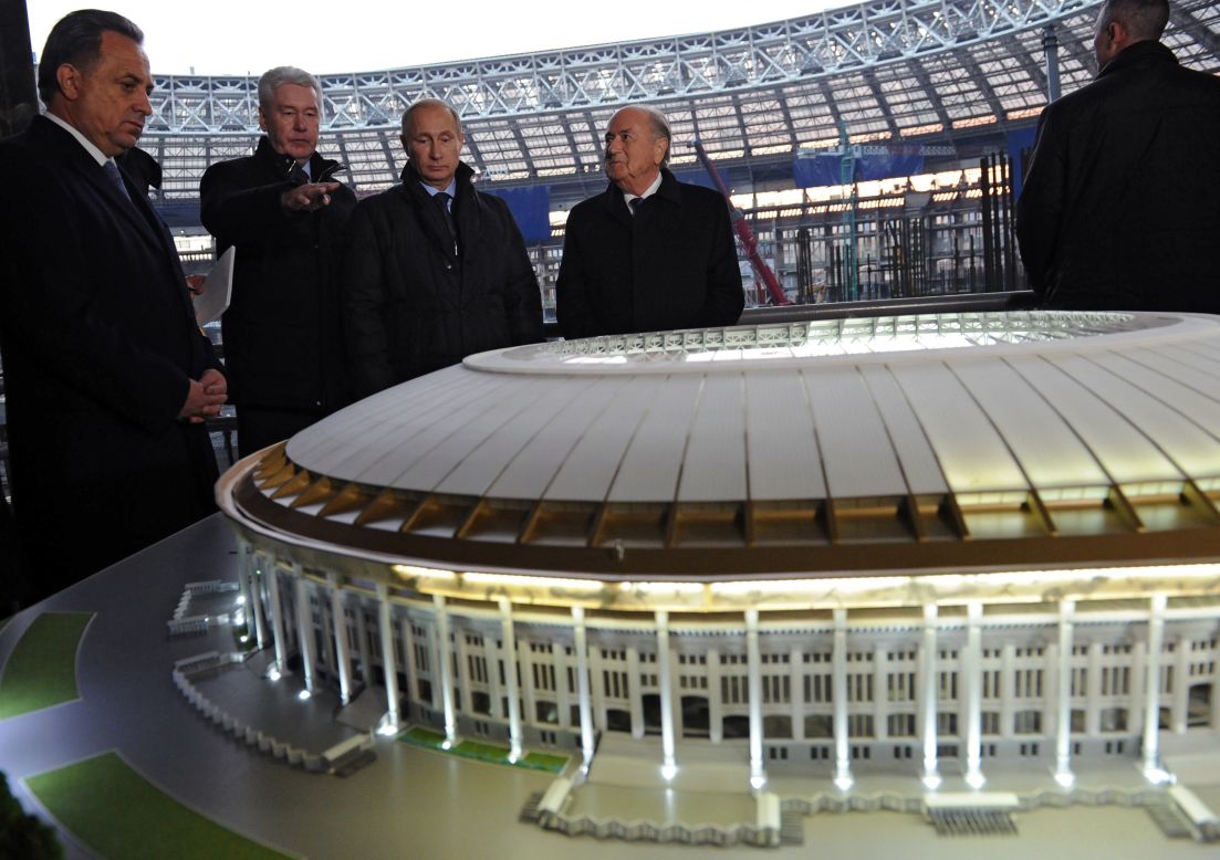 President Putin with Fifa officials. The 2018 World Cup could mean enormous profits for international contractors. 