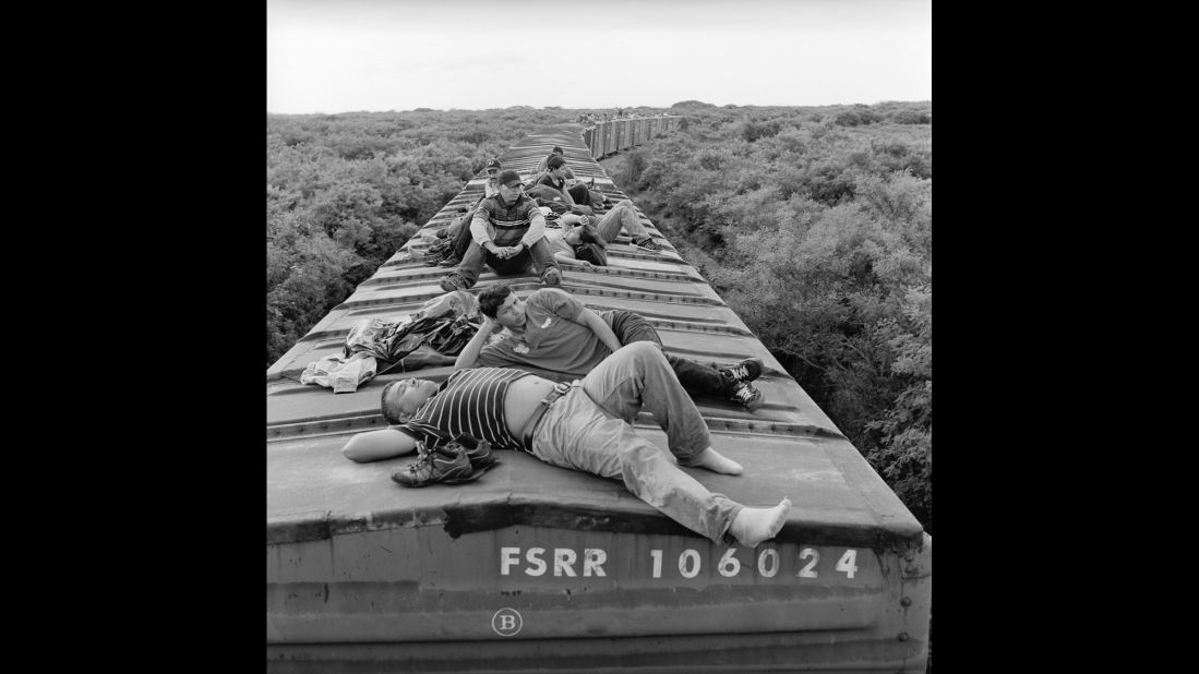 Migrants ride a northbound freight train through the southern Mexican state of Oaxaca in July 2010.
