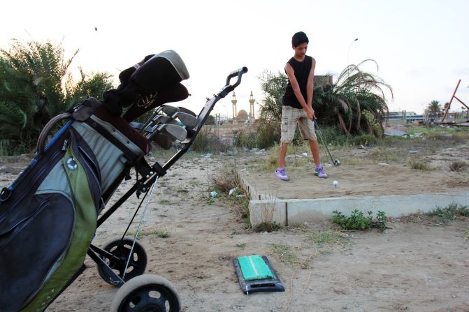 A Libyan boy tees off on one of the main beaches in Benghazi, the country's second city, in September 2012.