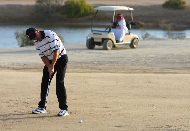 Here, Padraig Harrington of Ireland putts on the 17th hole during the Abu Dhabi World Sand Golf Championships at the Al Ghazal Golf Club in 2004.