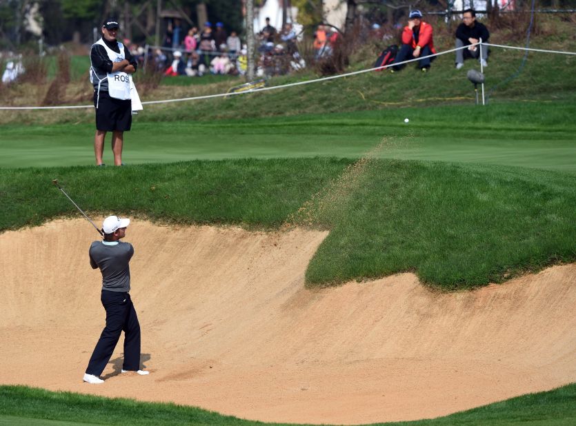 Emiliano Grillo hits a bunker shot during the final day of the BMW Shanghai Masters golf tournament at the Lake Malaren Golf Club in 2014.