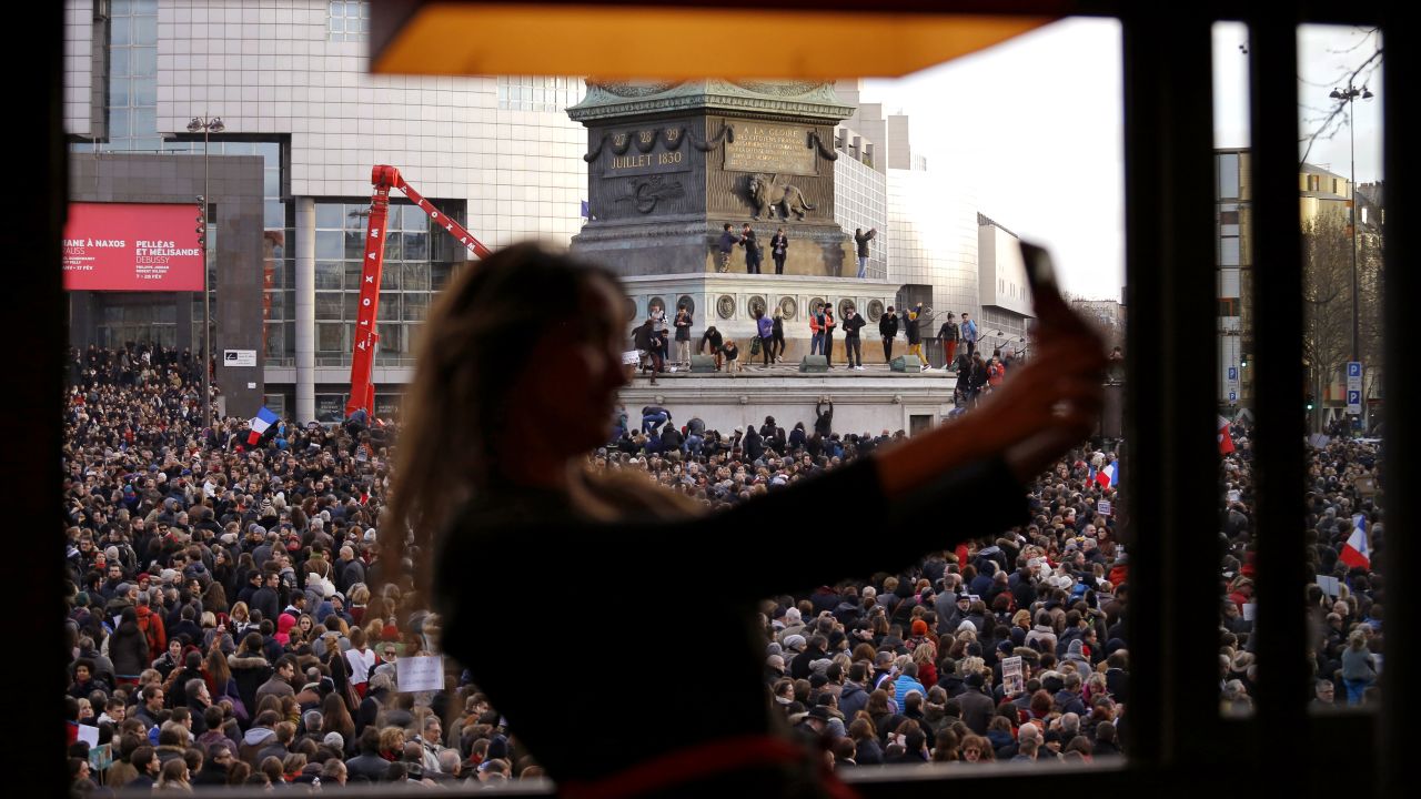 A woman takes a selfie in Paris' Bastille Square as a crowd gathers for a <a href="http://www.cnn.com/2015/01/11/world/gallery/paris-unity-rally/index.html" target="_blank">"unity rally"</a> on Sunday, January 11. More than a million people attended the rally, which took place days after Islamic extremists killed 17 people in the country.