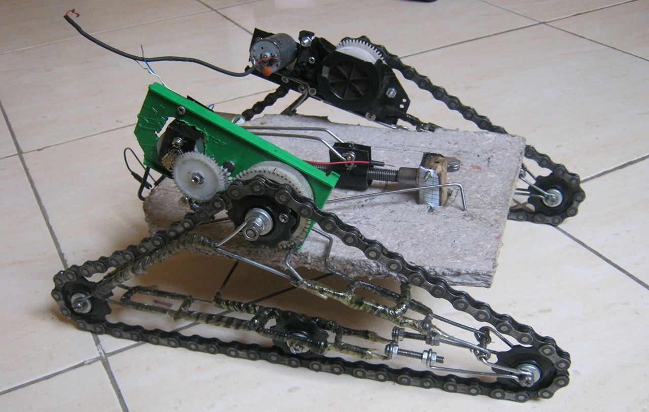 Fundi Bots student Victor Kawagga created this remote controlled robot called Attobot using 90% local or recycled materials. The wheels/tracks are bicycle chains and the frame is made of wire and paper mache.
