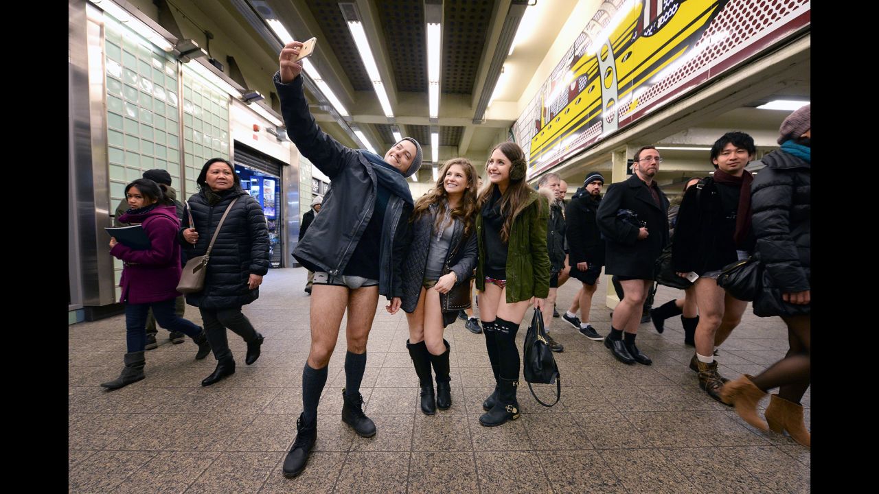 People pose in a New York train station during the annual "No Pants Subway Ride" on Sunday, January 11.