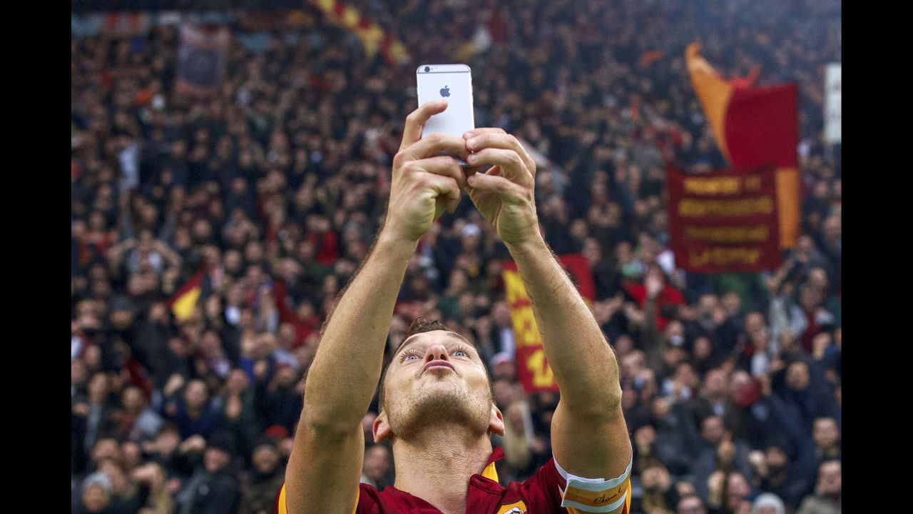 Soccer star Francesco Totti snaps a selfie after he scored a goal for Roma during an Italian league match Sunday, January 11, in Rome. <a href="http://www.cnn.com/2015/01/11/football/totti-selfie-roma-lazio/" target="_blank">Totti's celebration</a> came after his second goal of the game, which tied rivals Lazio at 2-2. The match ended in the same score.