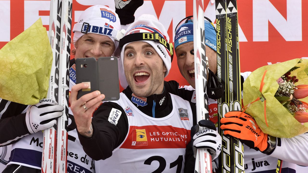 From left, skiers Magnus Krog, Magnus Hovdal Moan and Bernhard Gruber take a selfie on the podium after a Nordic combined race Sunday, January 11, in Chaux-Neuve, France.