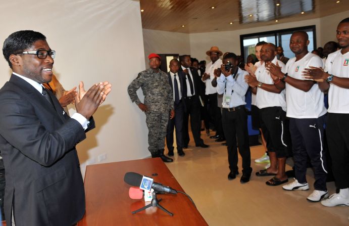 Teodorin hands over a check for $1 million to the Equatorial Guinea squad after the co-host beat Libya in a group game at the 2012 Africa Cup of Nations.