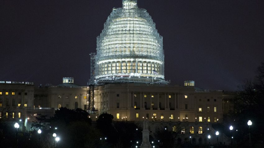 Lights illuminate the The U.S. Capitol, which is covered in scaffolding for ongoing restoration of the Capitol dome, in Washington, Wednesday, Jan. 14, 2015. (AP Photo/Jacquelyn Martin)