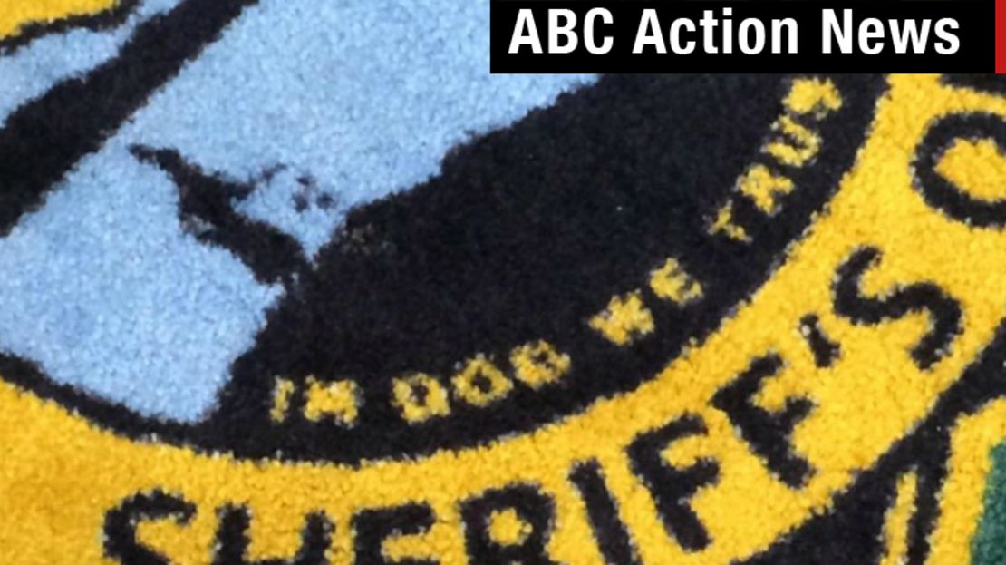 Sheriff's carpet: In Dog We Trust