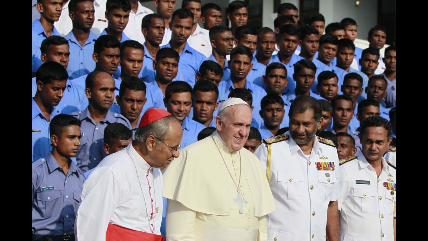 Francis joins Sri Lankan naval officers and Cardinal Malcolm Ranjith, front left, at the Benedict XVI Cultural Institute in Bolawalana, Sri Lanka, on January 15.