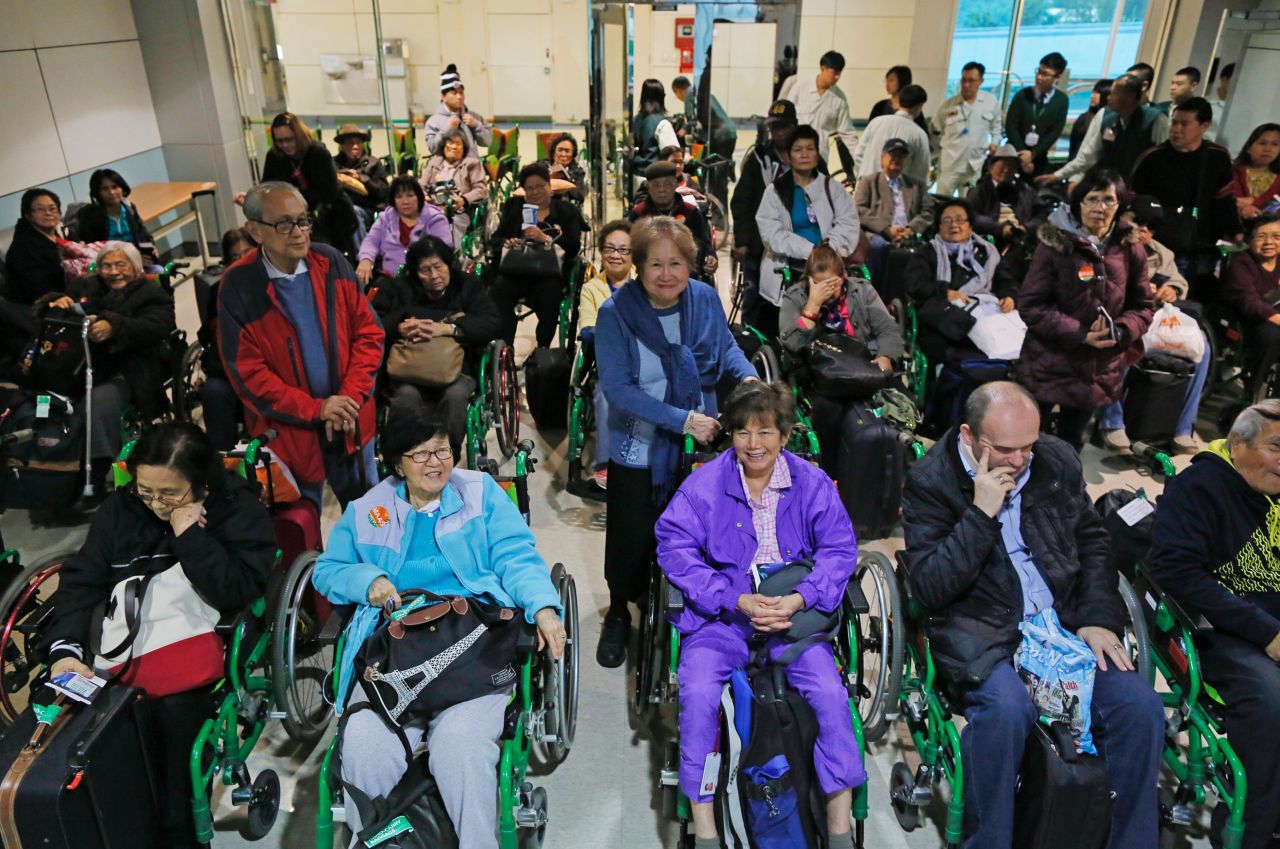 Forty elderly passengers wait to board their connecting flight to the Philippines at the Taoyuan International Airport in Taiwan on January 14. The elderly passengers, mostly Filipino, embarked on the long journey to the Philippines from the US and Canada in hopes of catching a glimpse of Pope Francis during his five day visit, a part of his Asia tour.