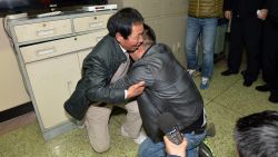 Sun Bin, right, who was abuducted in 1991 at the age of 4, kneels down and hugs his father Sun Youhong after they reunited in an office at the Chengdu Public Security Bureau in Chengdu city, southwest China's Sichuan province, 13 January 2015. Tears were flowing aplenty on Tuesday (13 January 2015), when a man from Sichuan, abducted when he was only four years old, finally became reacquainted with his father, 24 years later. Back in 1991, the then-toddler Sun Bin was whisked away by an abductor from a food market in Chengdu, Sichuan, where his father was working as a vendor, selling vegetables. He was eventually taken by the captor to Xuzhou in east China's Jiangsu province, reports Chinese news portal NetEase. At the age of 28, and eager to see his family again, Sun solicited the help of the public security bureau, who managed to locate his father, and helped set up a reunion. On meeting his father, Sun was reduced to tears as the two of them embraced. After the tears began to dry up, Sun's father Sun Youhong revealed some photographs that had been taken not long before the child was abducted. "During mid-autumn festival, when he was four years and 15 days old, we took photos of him," he told reporters, while showing them a picture of Sun, Sun's mother, and him. Sun was kidnapped only four days later, he added. After the abduction, the parents began searching the surrounding areas and putting up notices. Sun Youhong also told reporters about how his wife traveled far and wide, with unsuccessful visits to Chongqing, Ganzi, and Henan. The father spoke of the agonizing search, "as long as we had a sign, we went." He added that his wife had numerous blackouts throughout. Sun's mother passed away in 2012, leaving no chance for the complete reunion of the family. However, he did have the opportunity to meet his younger sister for the first time. She was born in 1994, about three years after Sun was abducted.(Imaginechina via AP Images)