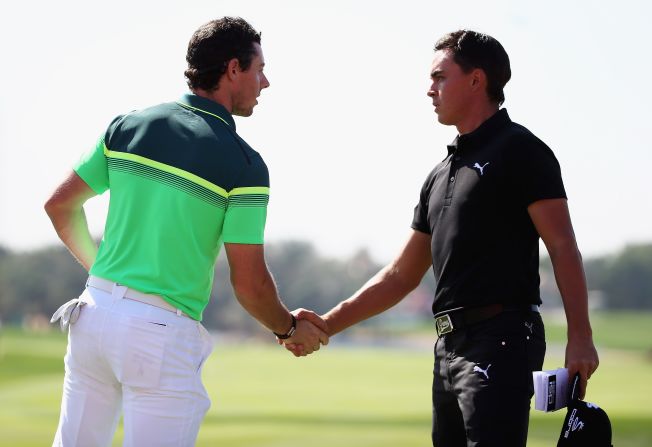 McIlroy shakes hands with his great rival  Fowler of the United States at the end of a first round in which they both shot five-under 67 but trailed Kaymer by three shots. 